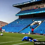 Home 15 에르난도 실레스 경기장 특징 - **High-Altitude Struggle on the Pitch:**
A wide-angle, dramatic shot capturing a pivotal moment ...